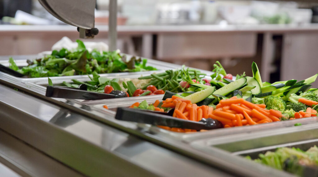 Photograph of salad bar with fresh vegetables